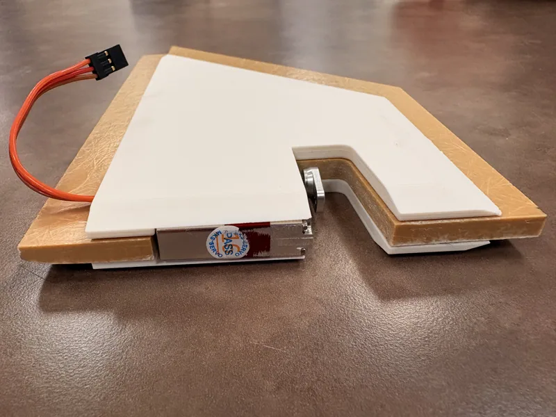 Layered fin construction with integrated servo and wiring visible
