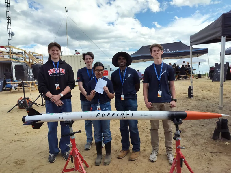 Five Horizon team members standing behind Puffin-1 at Launch Canada